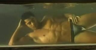 Underwater barefaced hottie in bulging speedos - video 2