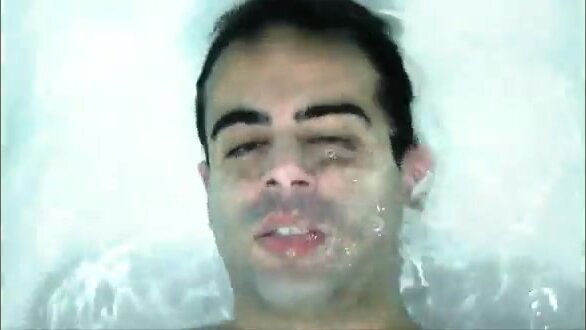 Barefaced cutie breatholding underwater in tub