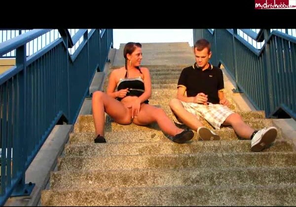 He sets camera - they both piss on the steps