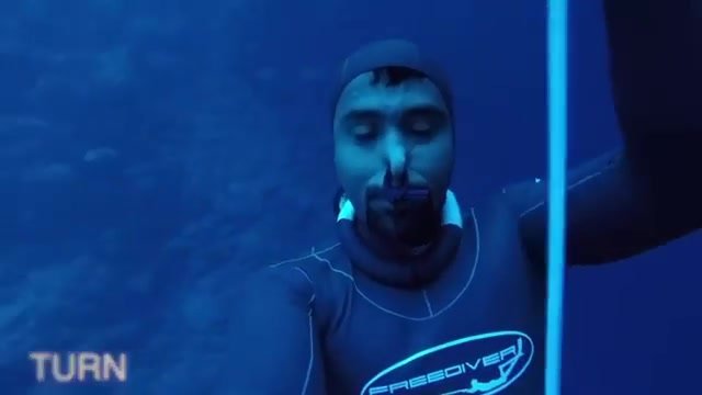 Arab freediver barefaced deep underwater closeup