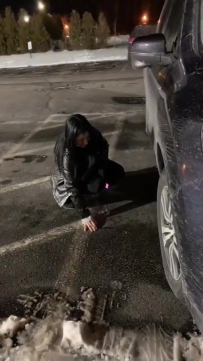 Girl pees on parking lot