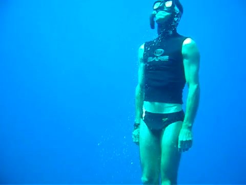 Underwater freediver breatholds in speedo