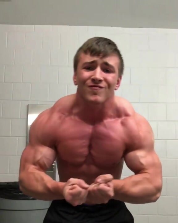 Big young Musclebeast Mitchell Milbrand flexes