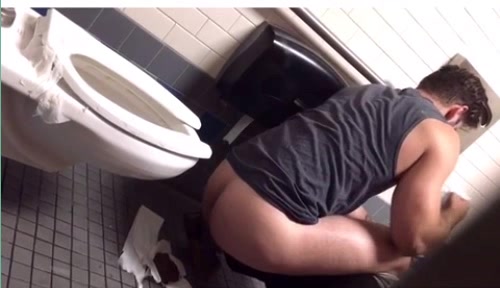 Hot Muscular dude poops on the floor in a public toilet