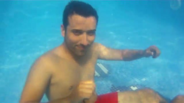 Underwater barefaced buddies in pool - video 2