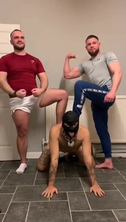 Alpha muscle masters posing with feet on fag