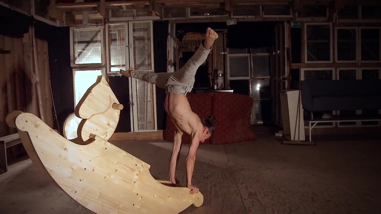 Handstand on a rocking horse