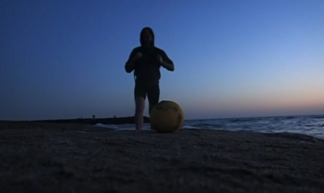 stomping a lemon on the beach