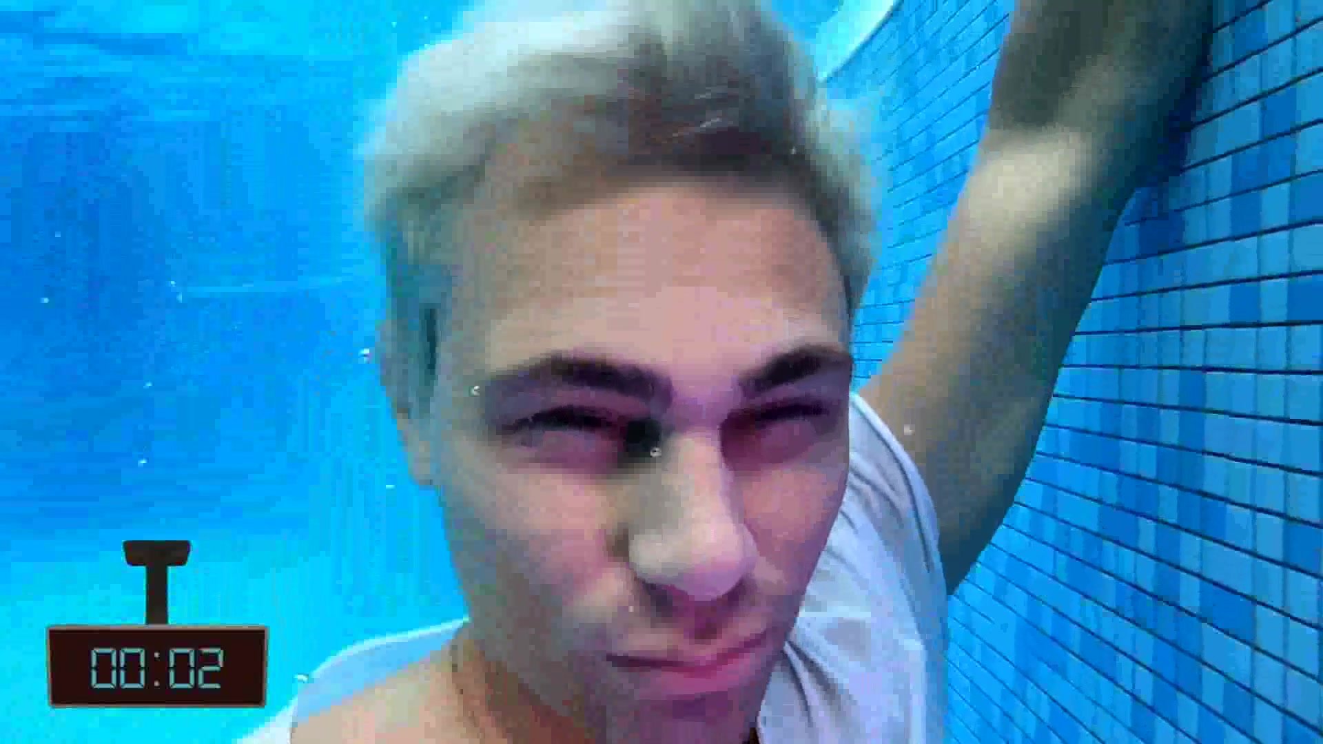 Bleached hair boy breatholds barefaced underwater