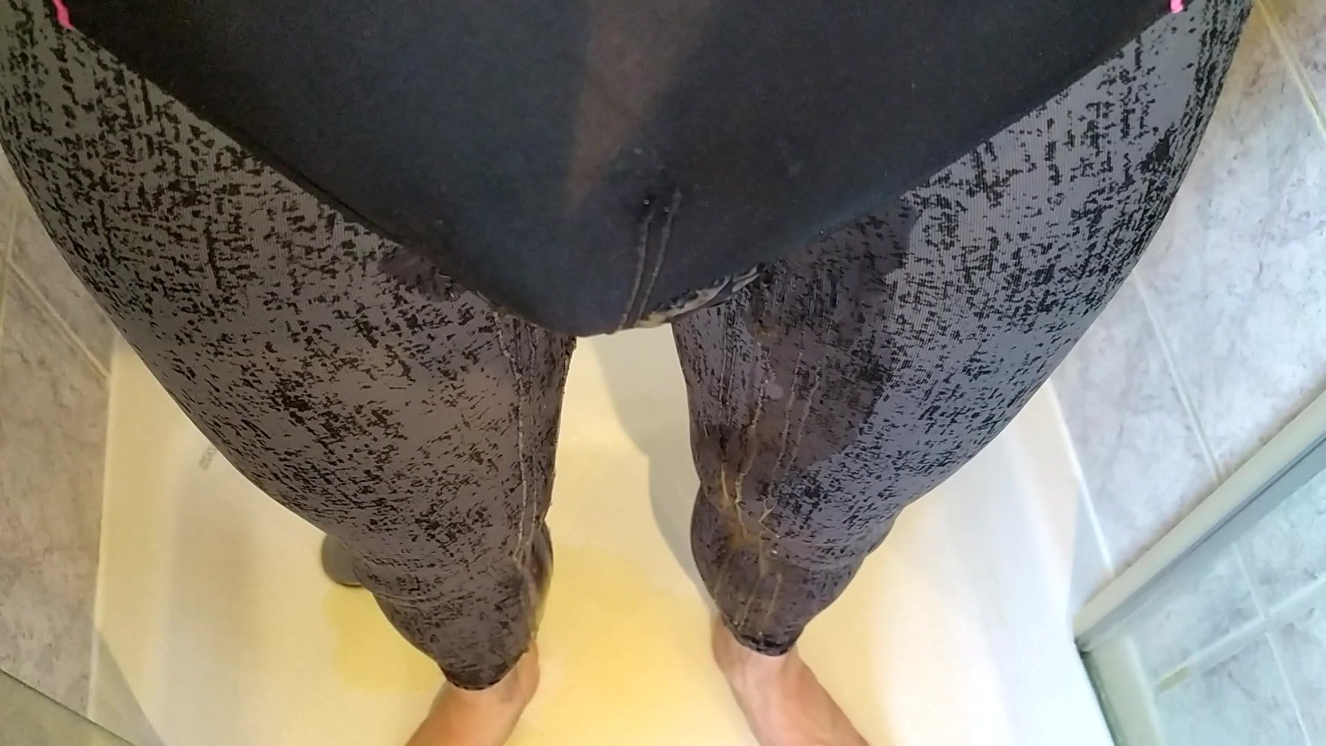 Wetting grey leggings and black swimsuit