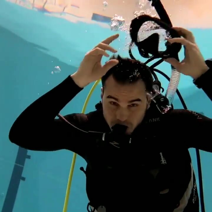 Cute scubadiver rips his mask off underwater