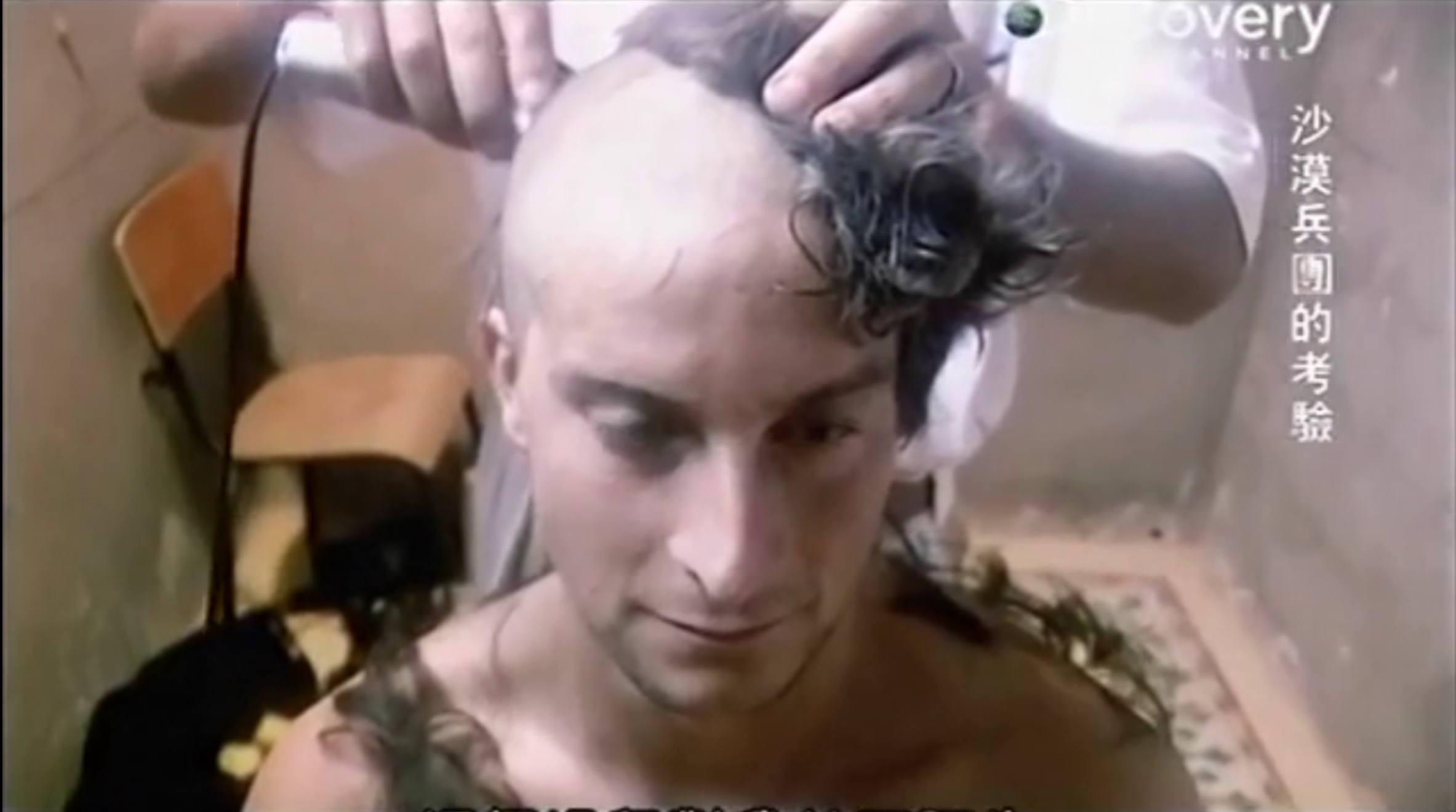 Recruits being headshave and tortured in the desert