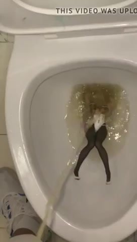 piss anime figure in public toilet