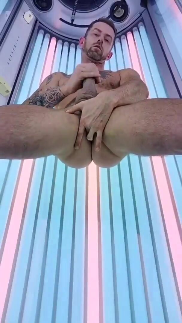 Inked pig nuts load in tanning booth