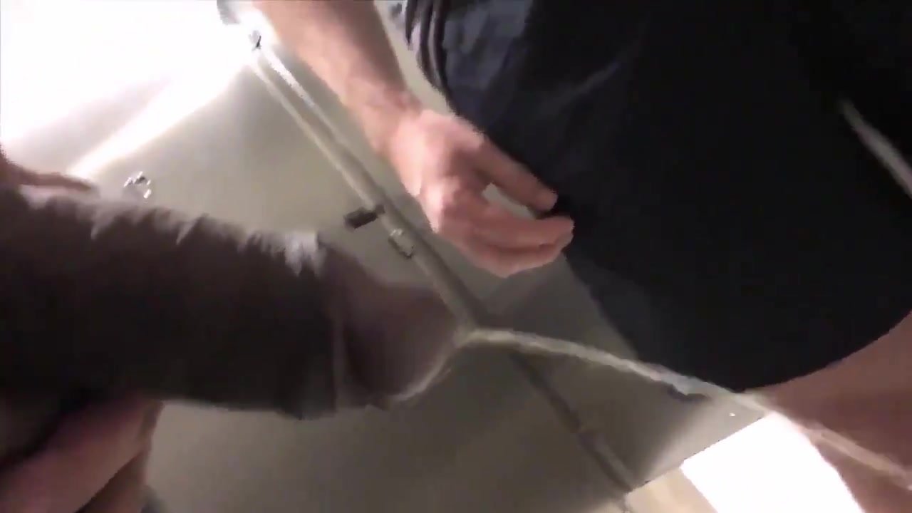 Young white jock takes piss in public restroom