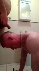 Piss pig gets a hot soaking on the floor