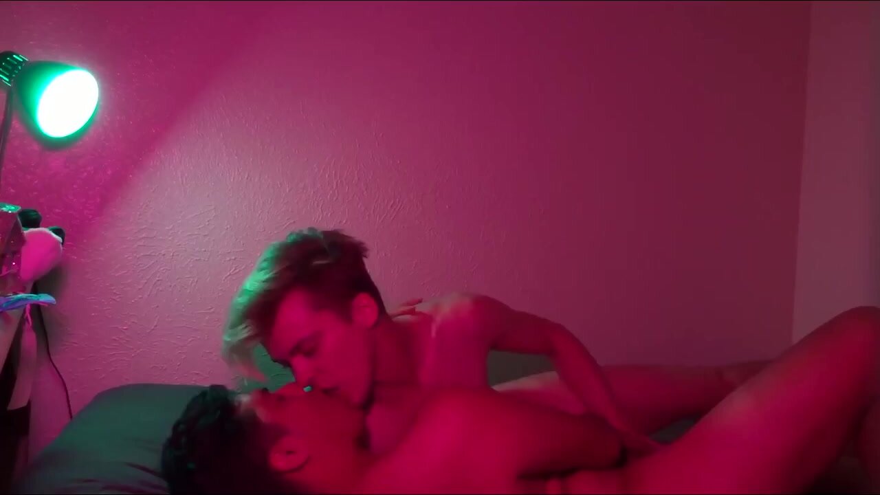Young men kissing each other