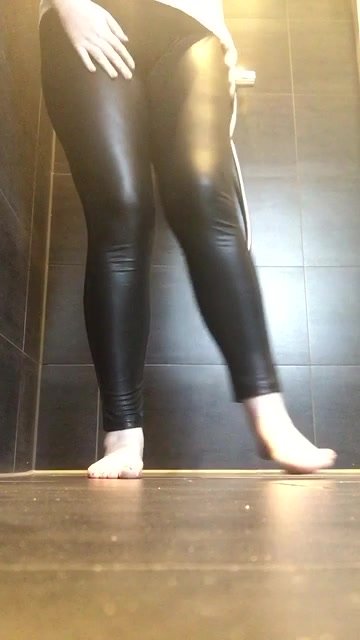 Girl in black shiny leggings pees in the shower