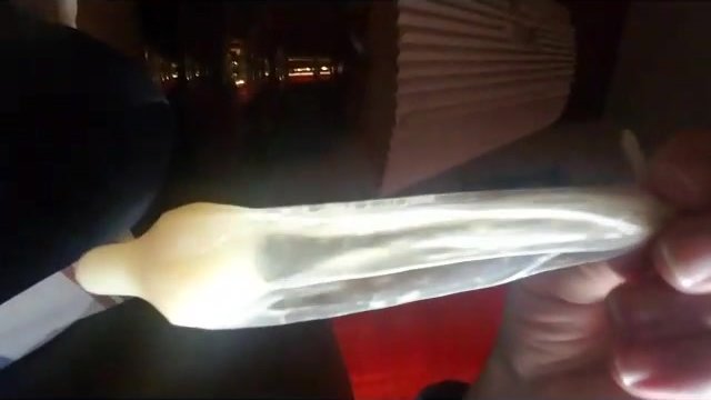 Enjoying a Large Cum Load in a Condom