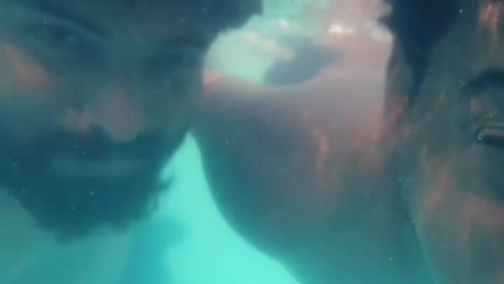 Underwater barefaced buddies in pool - video 3