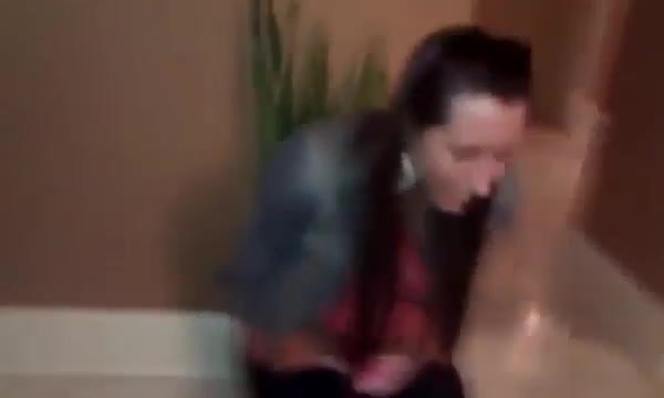 girl pees in plant pot in hallway