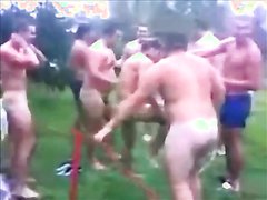 Rugby team take a shower outside