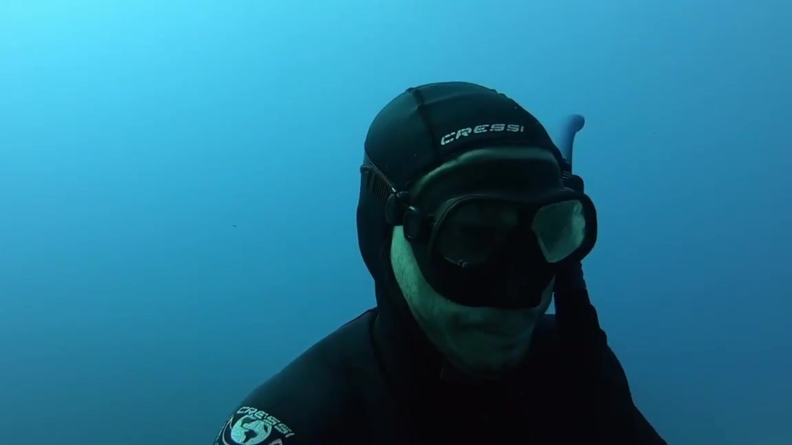 Sexy freediver underwater in a wreck