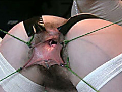 Pierced pussy pulled open for close up examination