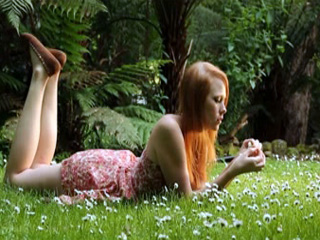 Redhead beauty in sundress masturbates wet pussy outdoors