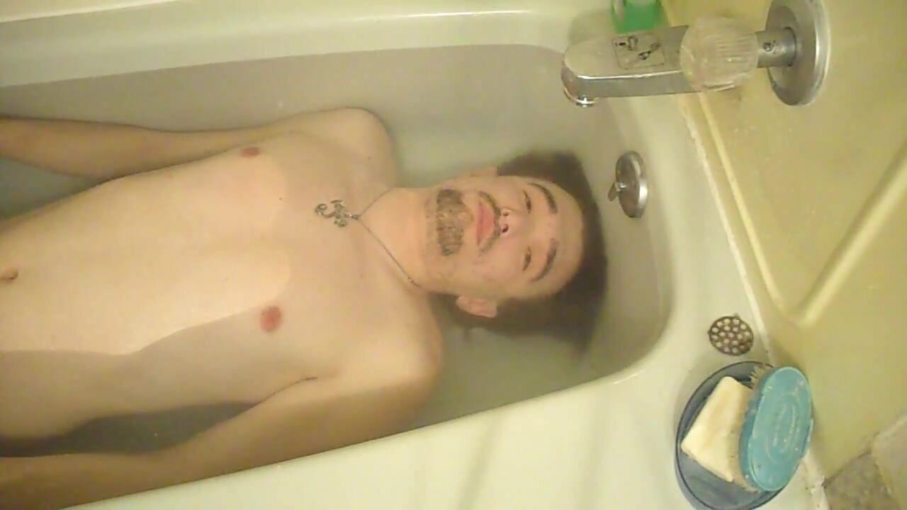 Lying barefaced underwater in tub - video 3