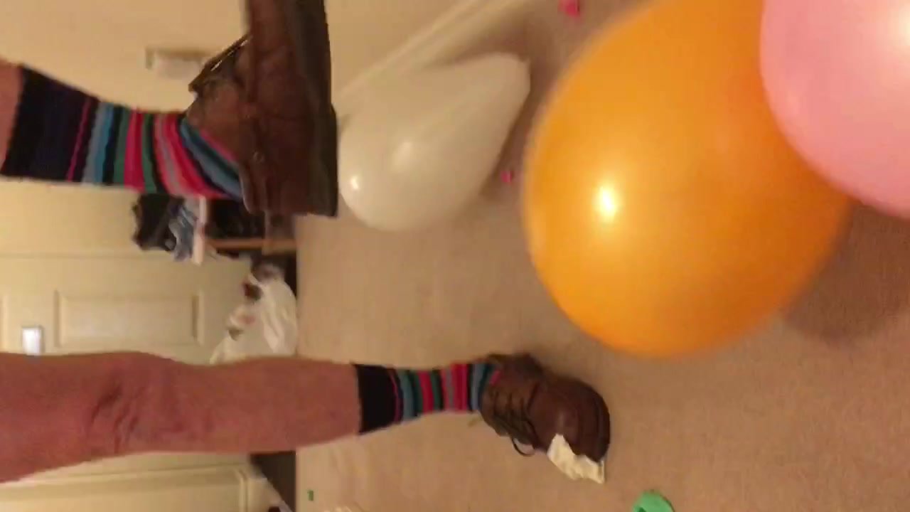 Sexy man stomping balloons - video 2