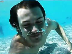 Long haired guy barefaced underwater