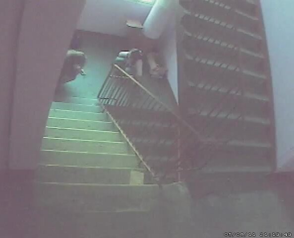 2 girls pee in staircase of public building