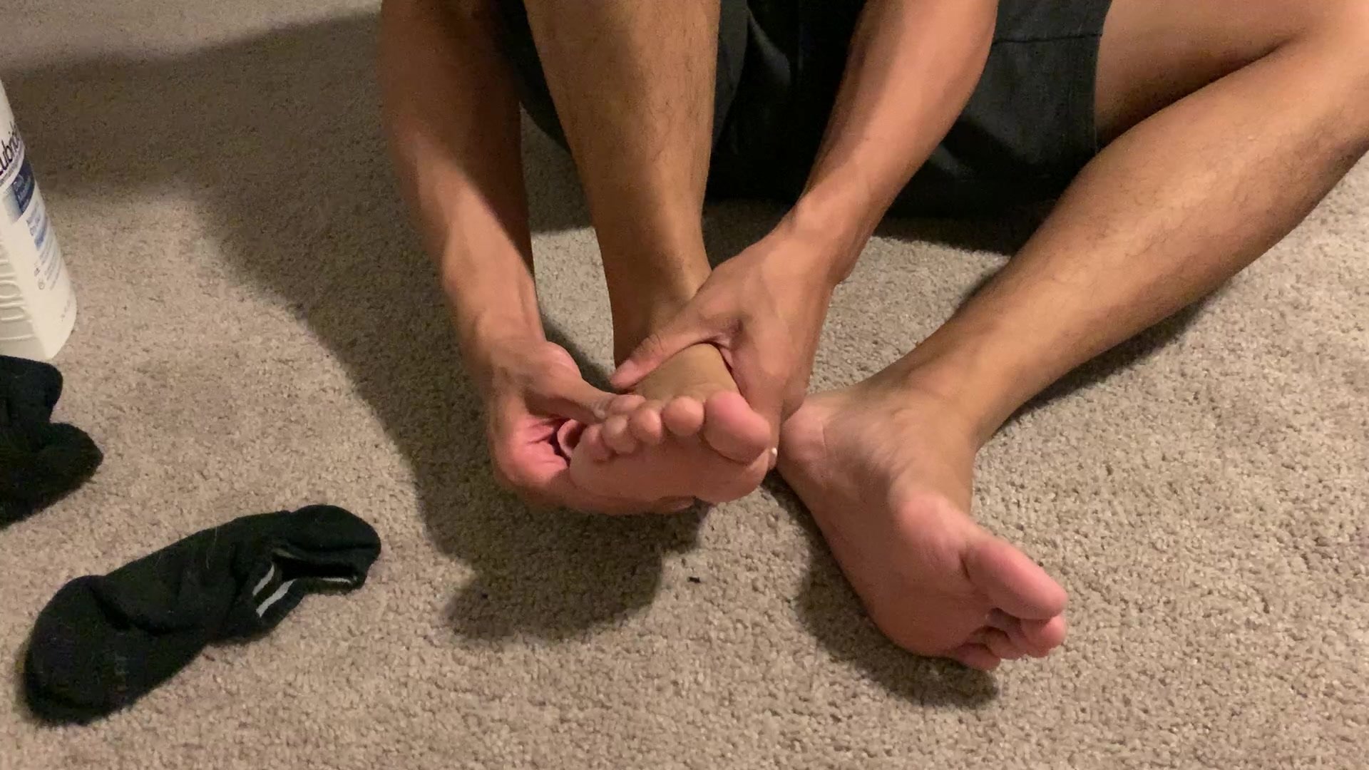 male foot massage with lotion