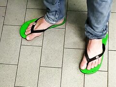 Candid green flip flops