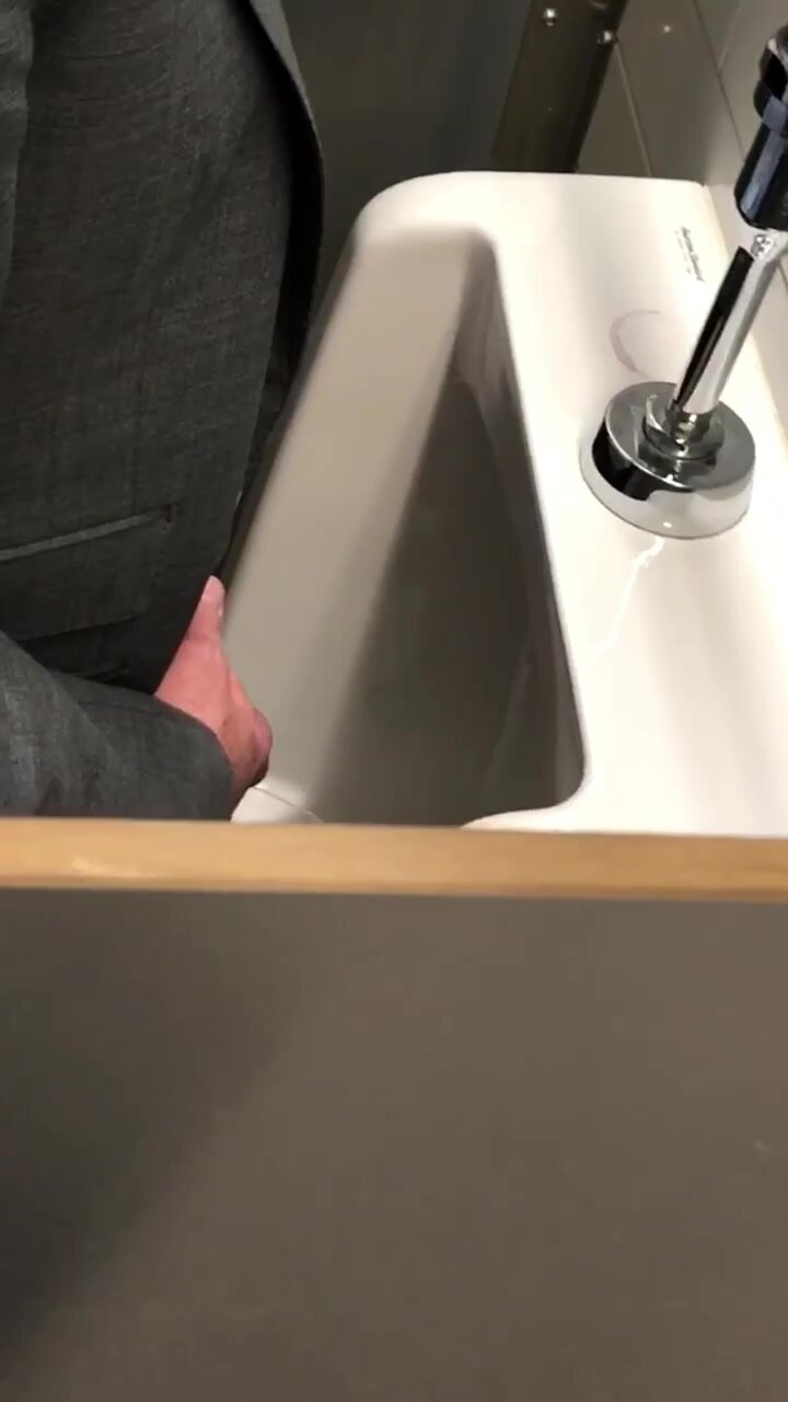 Distracted Business Daddy in urinal