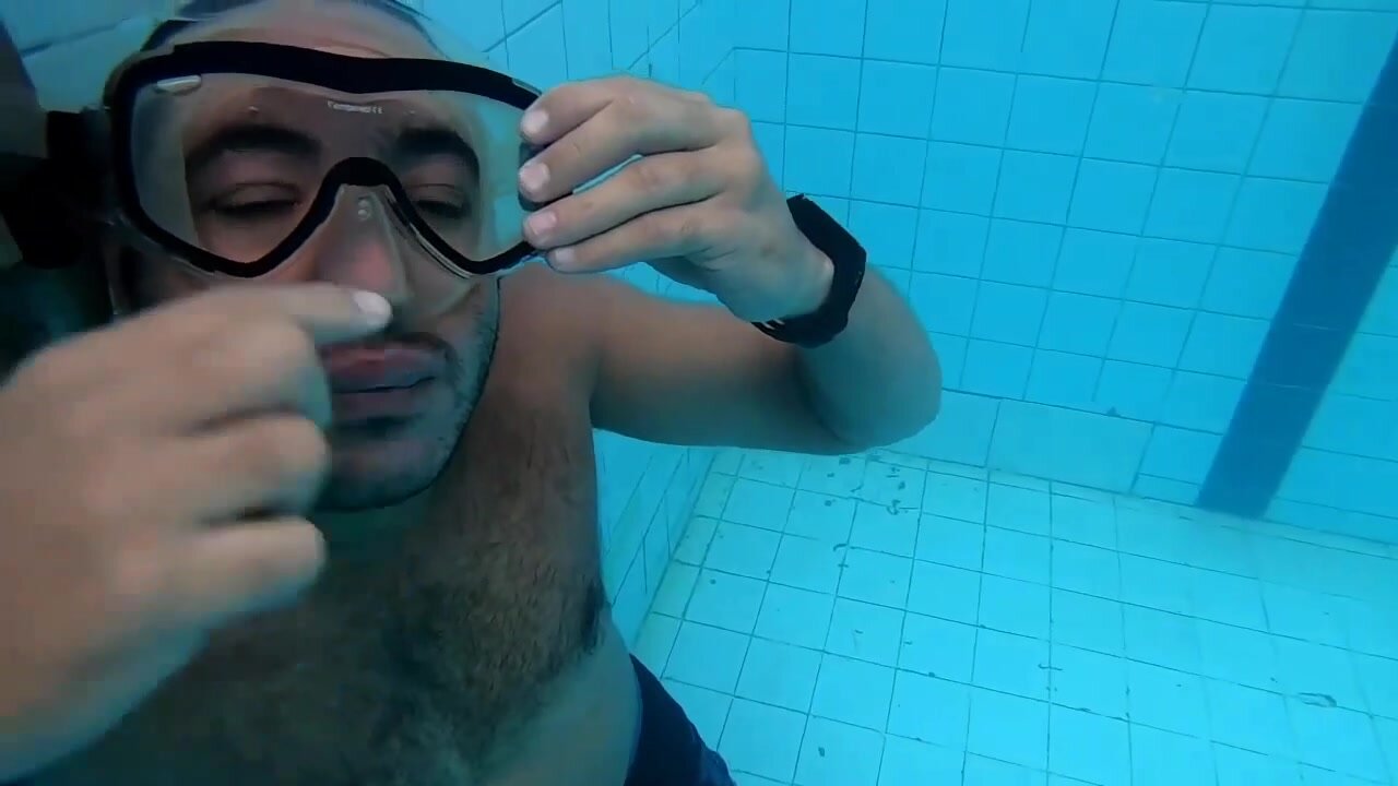 Kareem putting mask underwater
