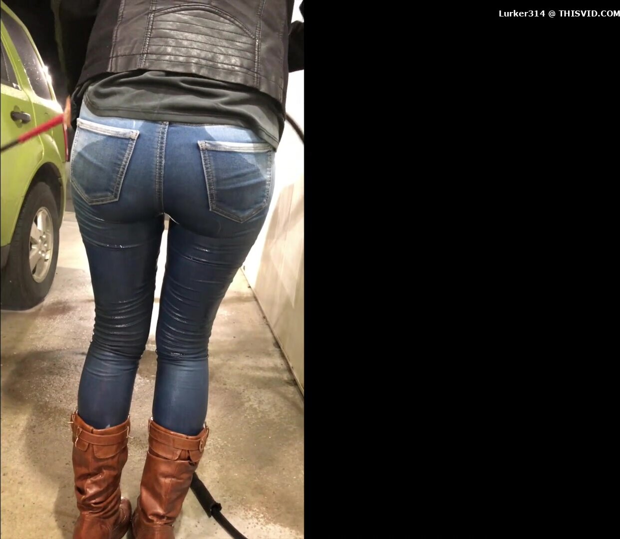 Pissing her jeans while washing car.
