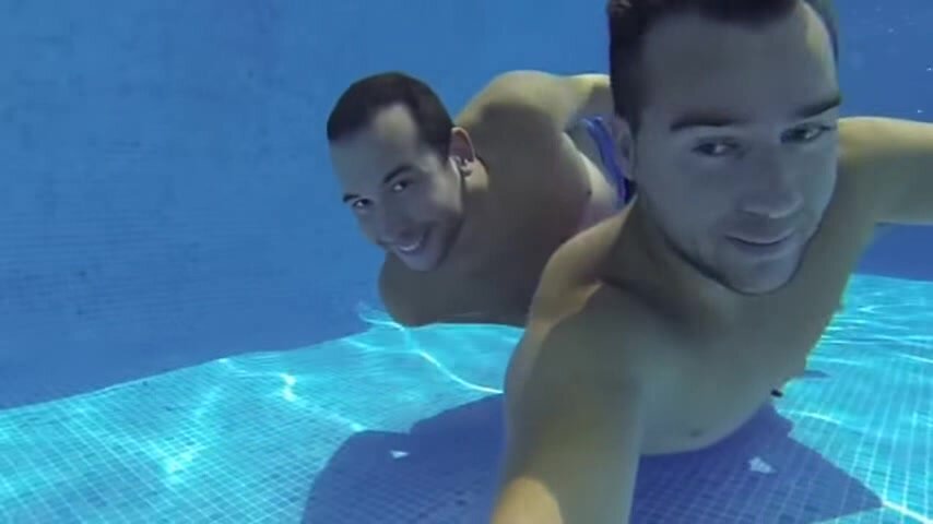 Underwater barefaced buddies in pool - video 4