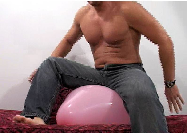 GYM GUY SITS ON BALLOONS
