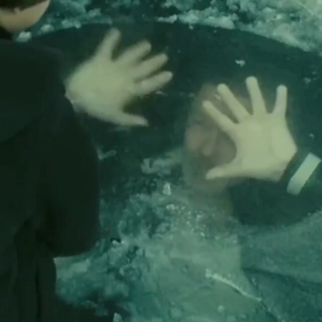 Guy drowning under ice