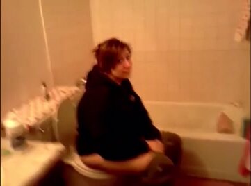 Sexy girl sitting on toilet