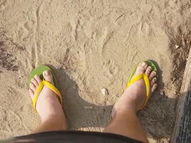 enjoying the beach with my old flip flops