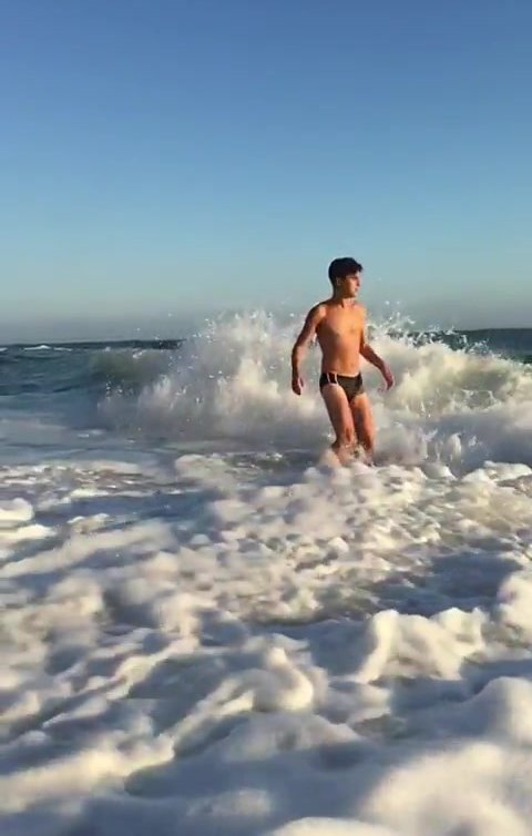 Enjoying the waves in a speedo