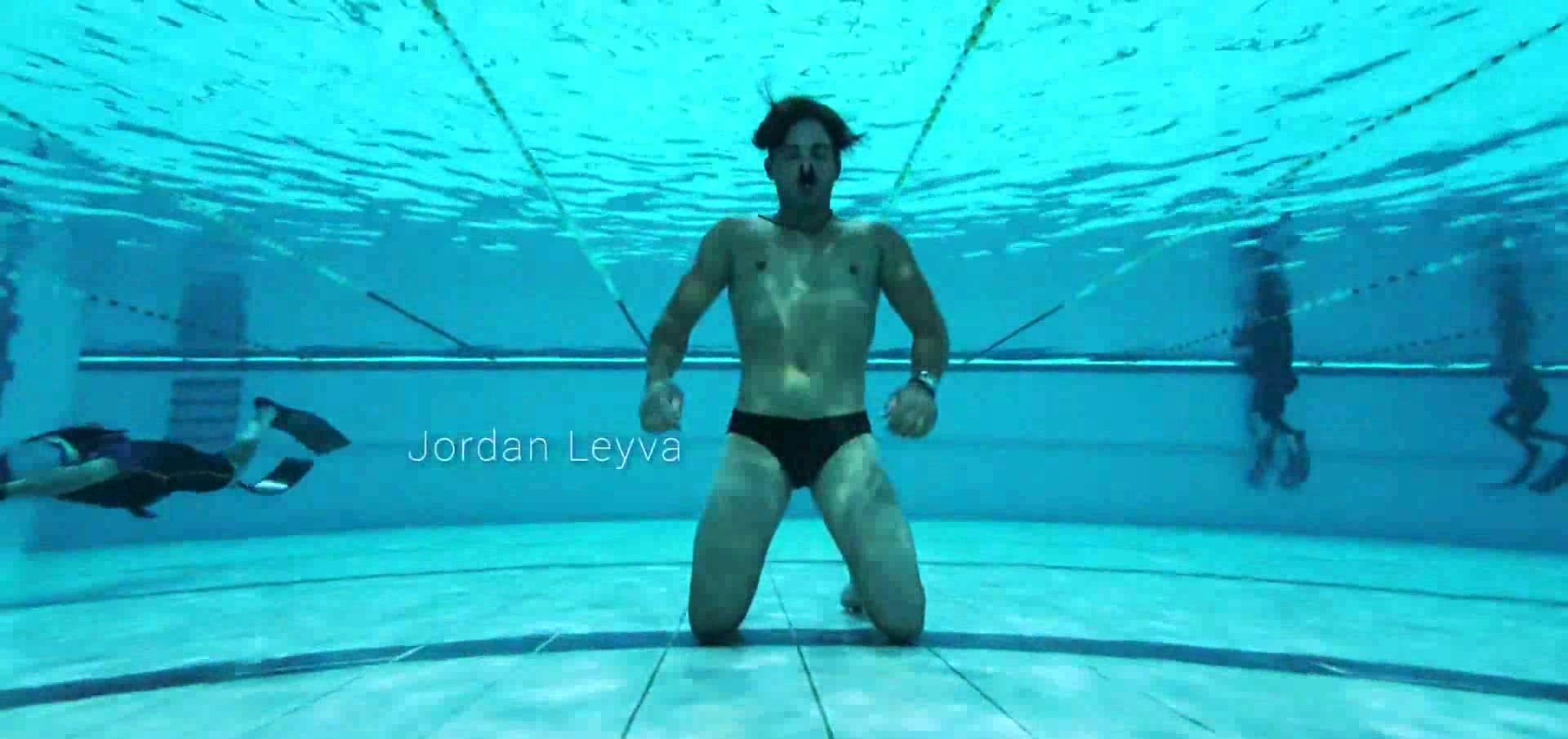 Jordan barefaced underwater in speedos