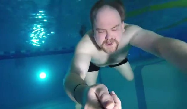 Bearded daddy barefaced underwater in pool