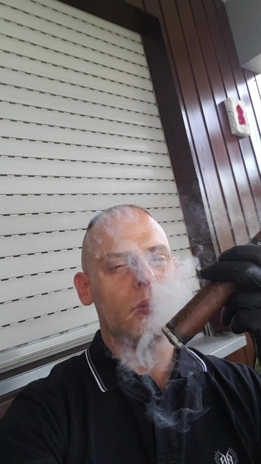 Skin smoking a Asylum 8x80 Cigar