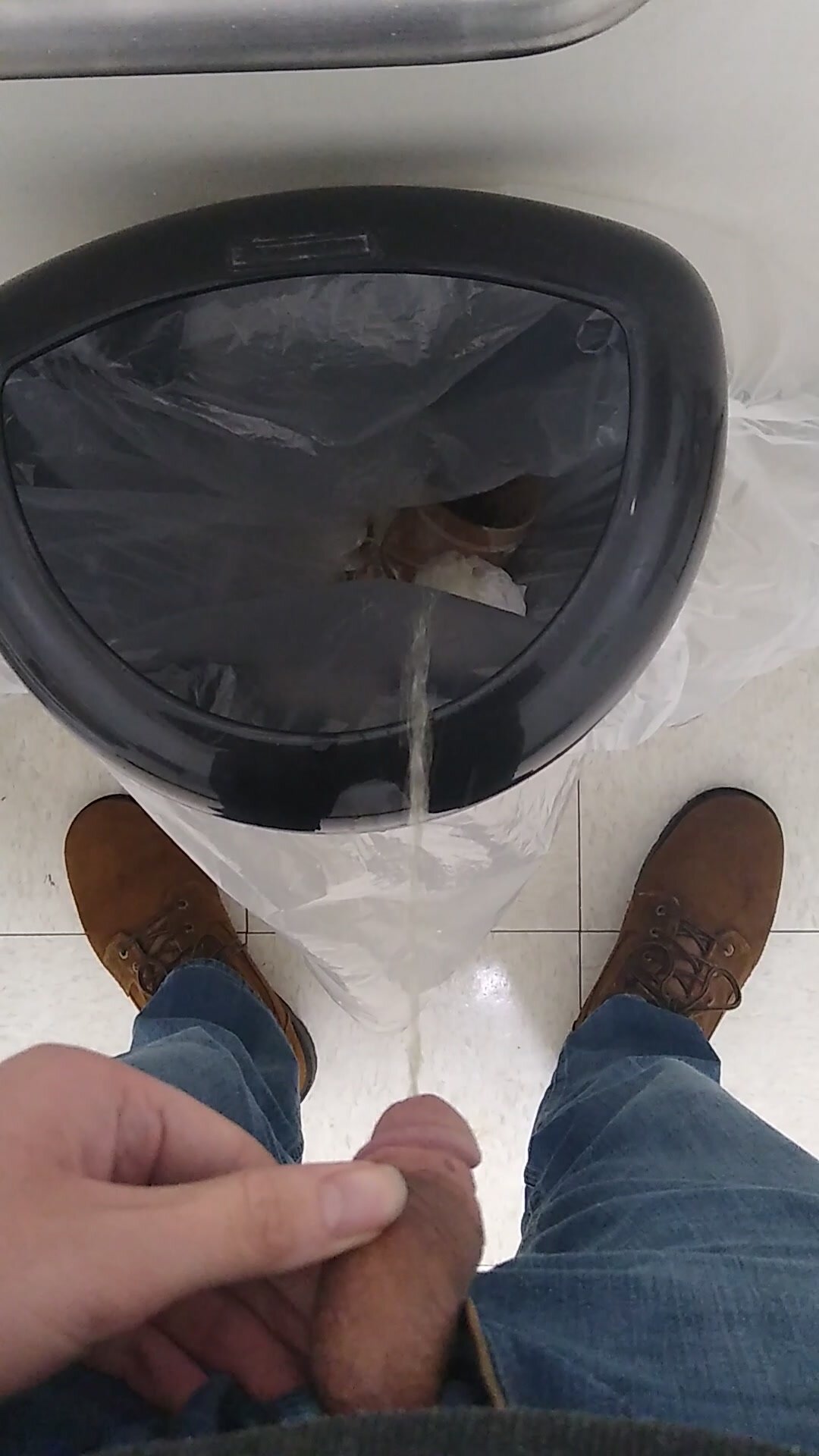 Piss in fabric store trash can