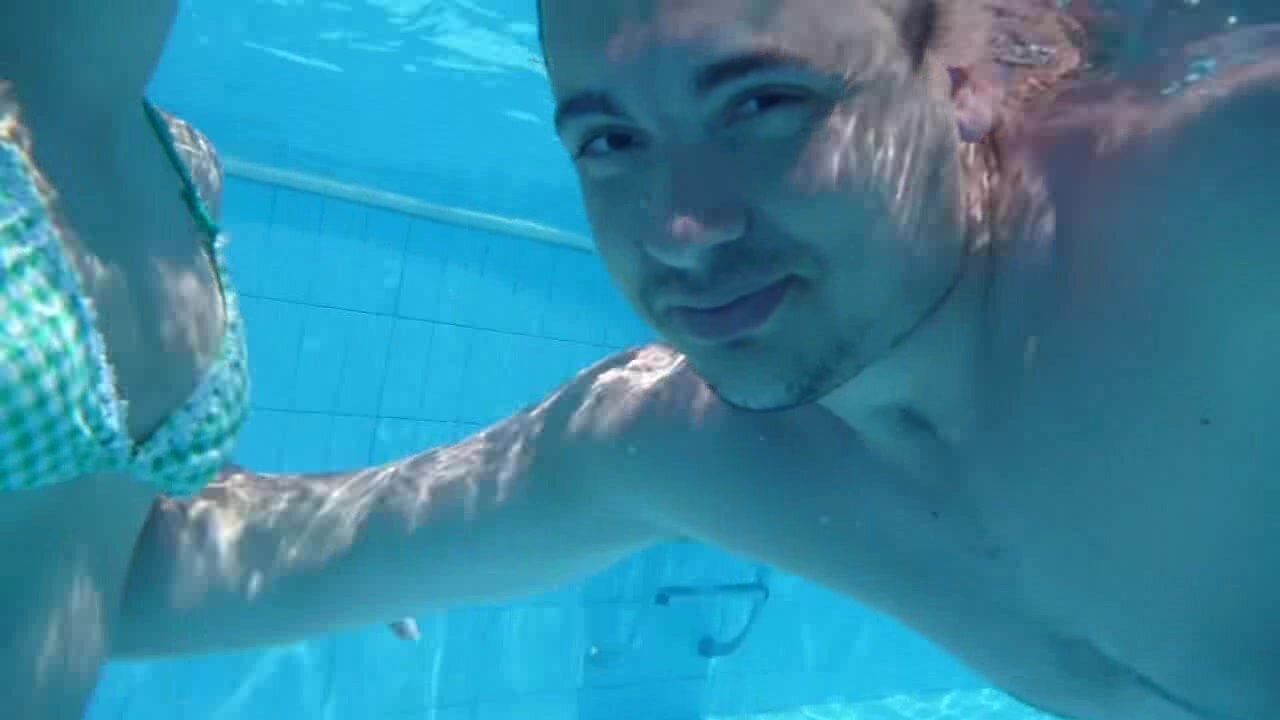 Beefy guy barefaced underwater in pool