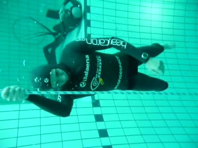 Alain barefaced underwater in wetsuit